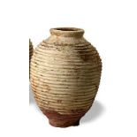 A similar terracotta beehive pithos storage jar