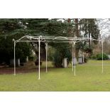 A wrought iron haut vent arbour French, mid 20th century 5m.; 16ft 5in long by 3m.; 9ft 10in wide