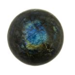 Minerals: A Labradorite sphere Madagascar presented on a velvet cushion 23cm.; 9ins diameter