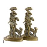 Two brass door porters in the form of a forester and his dog circa 1860 36cm.; 14ins high