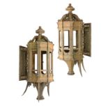 Lighting: A pair of substantial cast iron wall lanterns late 19th century 142cm.; 56ins high