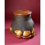 Natural History: An Elephant foot container with turned wooden lid circa 1890 on wooden base