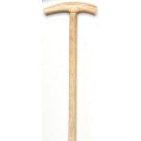 Walking canes: A whalebone and marine ivory stick 19th century 84cm.; 33ins long