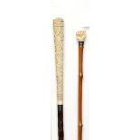 Walking sticks: A wood cane with foliate carved ivory top and silver collar with indistinct London