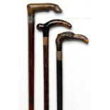 Walking canes: An ebonised stick late 19th century the horn handle carved with a flamingo head