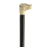 Walking sticks: An ebony cane 19th century the ivory carved dog's head top with inlaid eyes