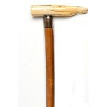 Walking Canes: A Malacca stick with ivory handle and silver collar hallmarked London 1852 87cm.;
