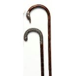 Walking canes: A wood stick with silver greyhound head handle with inlaid eyes hallmarked Birmingham