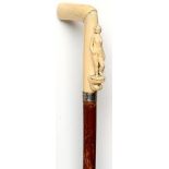 Walking canes: A Victorian Malacca stick the ivory handle carved with a naked figure circa 1860 with