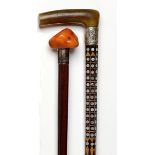Walking canes: A rosewood stick early 20th century inlaid with boxwood and mother of pearl and