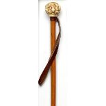 Walking sticks: A Malacca cane late 19th century with Japanese ivory top carved with multiple