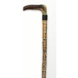 Walking sticks: A horn mounted vertebra cane late 19th century together with another vertebra