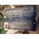 2 blue glass vases