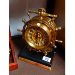 Brass clock in the shape of a ship's wheel