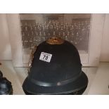 Policeman's helmet and picture