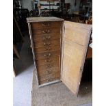 An Antique painted pine chest having 11 graduated drawers