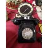 Black telephone and Baker lite clock