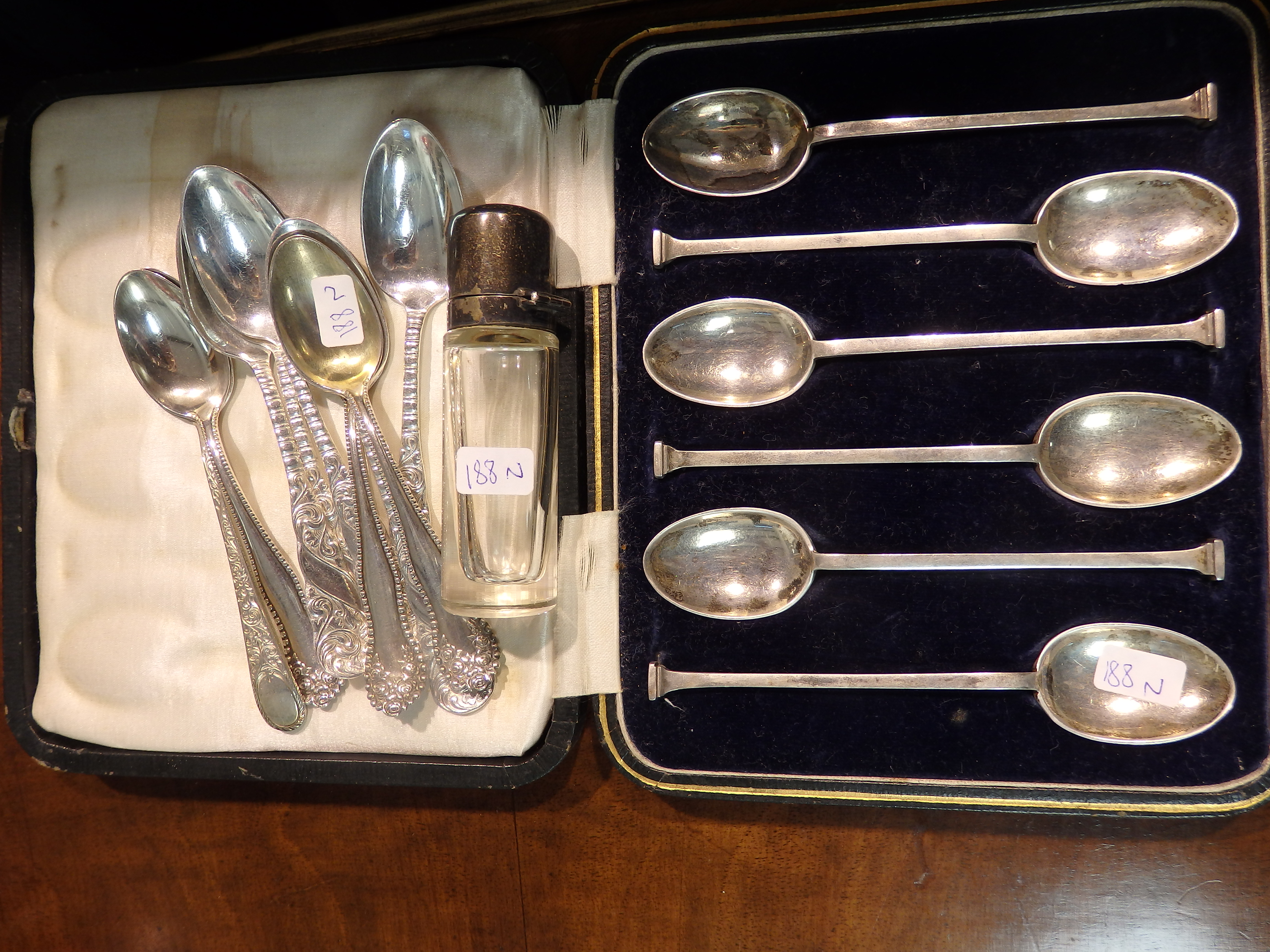 Silver spoons and scent bottle