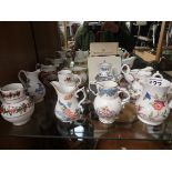 Collection of cream jugs and display shelves