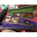 2 Violins in cases with 4 bows 1 marked Wolff bros. 1881