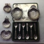 GOLDSMITHS & SILVERSMITHS CO., A CASED SET OF HALLMARKED SILVER SPOONS With decorative pierced