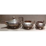 A VICTORIAN HALLMARKED SILVER THREE PIECE TEA SERVICE Of circular shape, with a reeded central