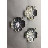 A SET OF THREE .925 SILVER DISHES In the form of four leaf clovers.