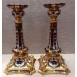 ROYAL CROWN DERBY, A PAIR OF 20TH CENTURY CANDLESTICKS With four dolphin heads, resting on an