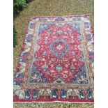 A LARGE PERSIAN RUG OF CARPET PROPORTIONS The pictorial decoration of ewers, vases and exotic birds,