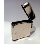 AN ANTIQUE HALLMARKED SILVER POCKET VESTA CASE With hinged match container and striker below, on a