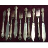 A PART SET OF TEN HALLMARKED SILVER HANDLED FISH KNIVES AND FORKS Each handle decorated with