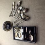 A MIXED LOT OF SILVER To include a circular picture frame, baby spoons and a tea straining spoon,