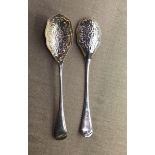 A PAIR OF ENGLISH HALLMARKED SILVER SPOONS With relief decorated bowls.