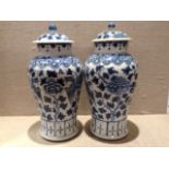 A PAIR OF CHINESE EXPORT VASES AND COVERSOf baluster shape, hand painted with dragons and flowers,