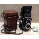 ROLLEICORD, D.B.P., 1380665, D.B.G.M., A TWIN LENS CAMERA Having an ebonized body, retaining