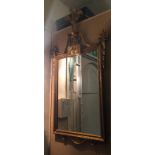 A PAIR OF EARLY 20TH CENTURY GILT FRAMED MIRRORS Crested with Prince of Wales feathers and