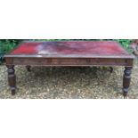 A VICTORIAN OAK PARTNERS WRITING TABLE With six drawers, raised on reeded turned legs.