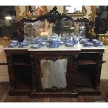 A VICTORIAN MAHOGANY MIRRORED BACK CREDENZA  With a breakfront marble top, above a central