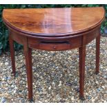 A LATE 18TH CENTURY MAHOGANY FOLD OVER CARD TABLE With green baize surface, above a single drawer,