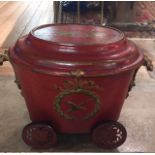 A 19TH CENTURY RED PAINTED TOLEWARE OVAL CORAL BUCKET Painted with trophies, instruments and an