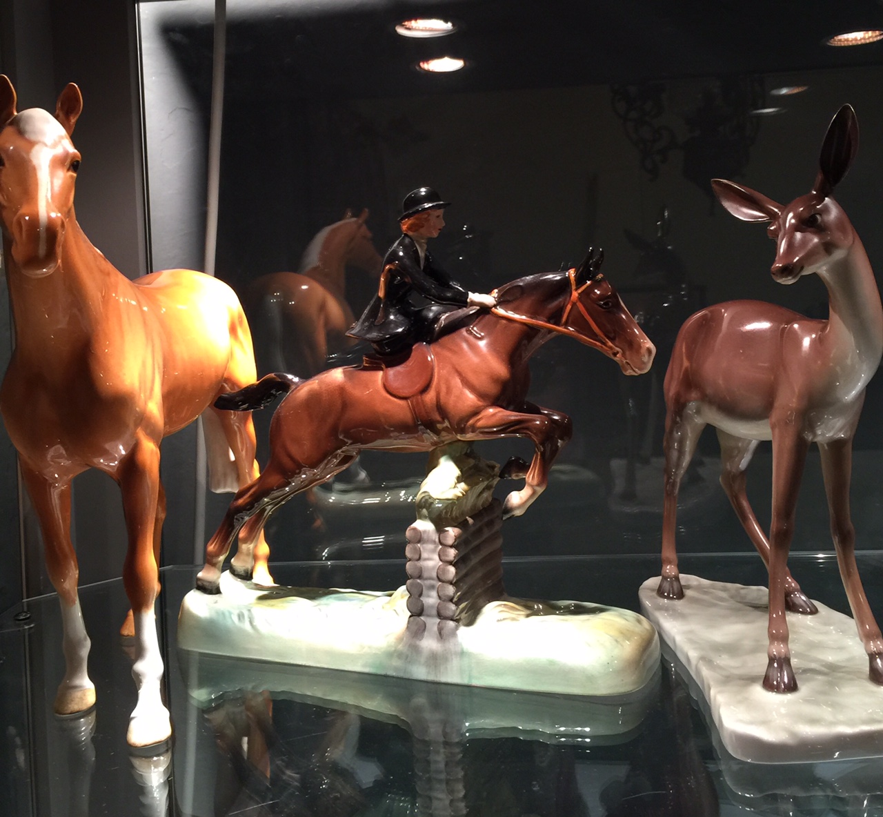 A LARGE BESWICK GROUP 'Show Jumper', along with a Beswick Palemino horse and a Portugese figure of a