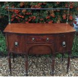 A GEORGE III PERIOD MAHOGANY TRAFALGAR EBONY LINE INLAID BOW FRONTED SIDEBOARD With brass gallery