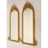 A PAIR OF VICTORIAN GILT GESSO ARCHED RECTANGULAR PIER GLASSES With ovolo and beaded moulded border,