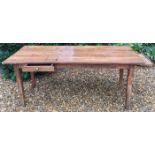 AN 18TH CENTURY FRENCH ELM FARMHOUSE TABLE With a plank top above a single end and a side drawer,