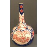 A 19TH CENTURY JAPANESE IMARI PORCELAIN FLOWER BUD VASE Having a narrow tapering neck and circular