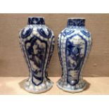 A PAIR OF 18TH CENTURY CHINESE BLUE AND WHITE VASES Having tapering fluted body, the centre panel