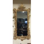 A LARGE AND IMPRESSIVE PAIR OF 18TH CENTURY DESIGN GILTWOOD FRAMED MIRRORS Heavily carved with