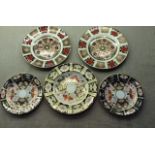 A COLLECTION OF ROYAL CROWN DERBY PORCELAIN PLATES Three side plates and two smaller plates, each