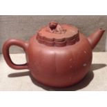 A 20TH CENTURY CHINESE YIXIN POTTERY MELON FORM TEAPOT With a temple dog finial to a crysanthemum