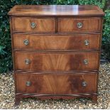 A GEORGIAN DESIGN MAHOGANY AND LINE INLAID BOW FRONTED CHEST Of two over three drawers, raised on